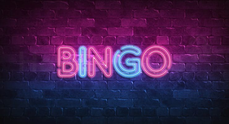 Neon light bingo sign at wall